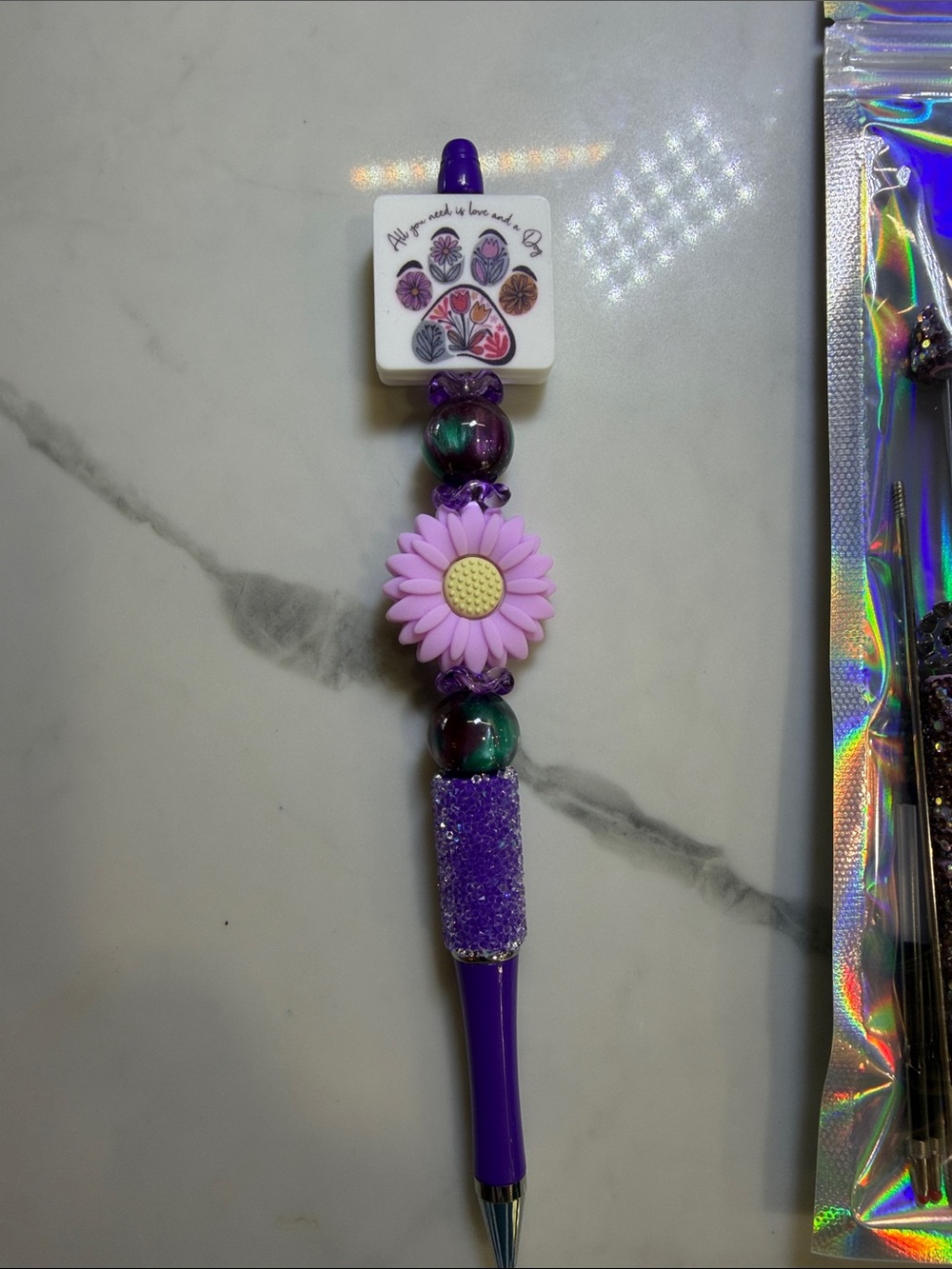 “All you need is love and a dog,” beaded pens plus 5 kits to make your own. $3